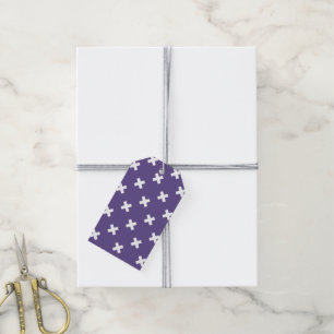 Witte kruisstiften op ultraviolet cadeaulabel