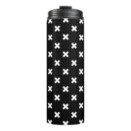 Witte kruisstiften op zwart thermosbeker