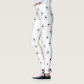 Witte legging gevuld met zwarte spinnen (Links)