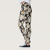 Witte madeliefjes op zwart bloemmotief leggings (Links)