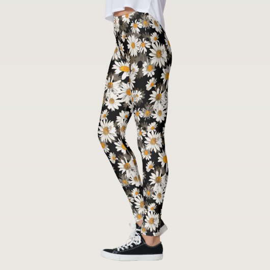 Witte madeliefjes op zwart bloemmotief leggings (Links)