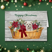 Witte Maltese puppy met kerstkaart voor mandje