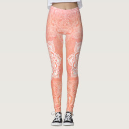 Witte mandala's op de achtergrond van koraalmarmer leggings