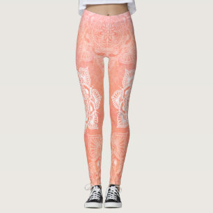 Witte mandala's op de achtergrond van koraalmarmer leggings