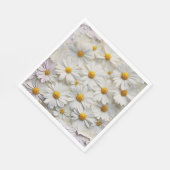 Witte margrieten over noodlijdend papier servet (Hoek)