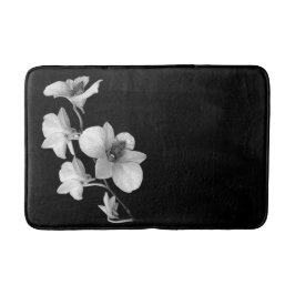 Witte orchidee op zwarte badmat II
