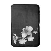 Witte orchidee op zwarte badmat II (Voorkant Verticaal)