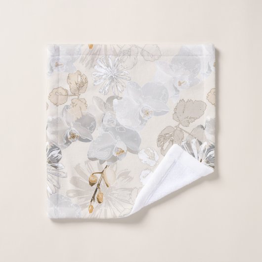 Witte orchideeën op een lichte crème bad handdoek (Wasdoekje)