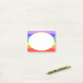 Witte ovaal op mooie regenboog post-it® notes (Op bureau)