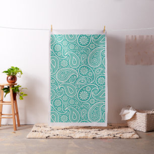 Witte paisley op de achtergrond van turkooizen stof