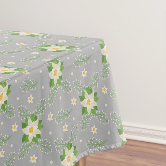 Witte Poinsettias Groene bladeren Kerstmis op Grij Tafelkleed (Voorbeeld)