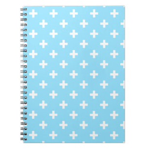 Witte polka kruist op babyblauw notitieboek
