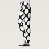 Witte polka-stippen groot op zwart leggings (Links)