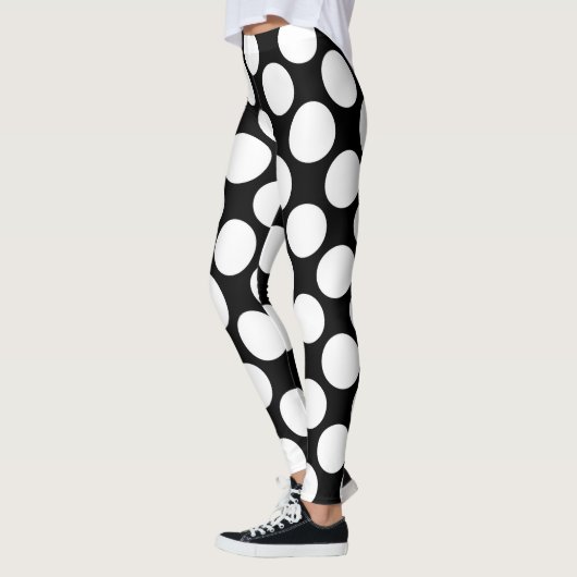 Witte polka-stippen groot op zwart leggings (Links)