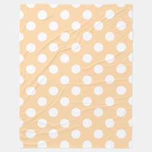 Witte polka stippen op beige fleece deken