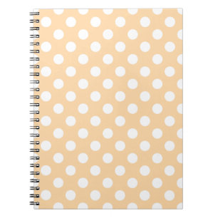 Witte polka-stippen op beige notitieboek