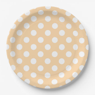 Witte polka-stippen op beige papieren bordje