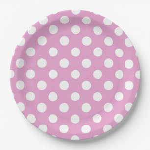 Witte polka stippen op bleek roze papieren bordje