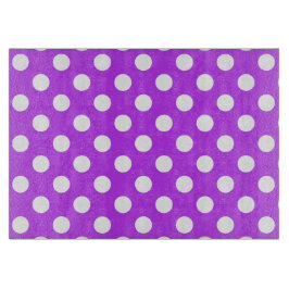 Witte polka-stippen op helder paars snijplank