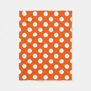 Witte polka stippen op oranje fleece deken