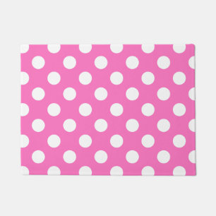 Witte polka stippen op roze deurmat