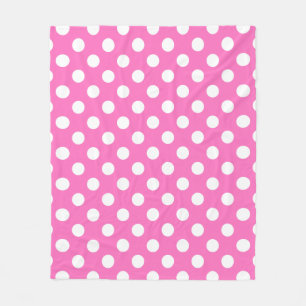 Witte polka stippen op roze fleece deken