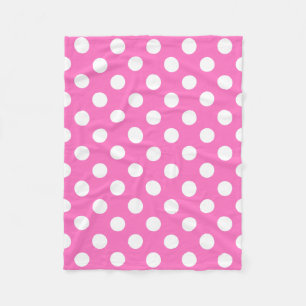 Witte polka stippen op roze fleece deken