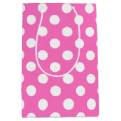 Witte polka stippen op roze medium cadeauzakje (Voorkant)