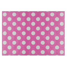 Witte polka stippen op roze snijplank