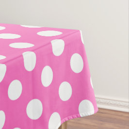 Witte polka stippen op roze tafelkleed