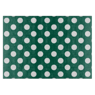 Witte polka-stippen op zonegroen snijplank