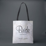 Witte pony's & Reflecterende Hearts Wedding Bride Tote Bag<br><div class="desc">Deze mooie canvas tas is perfect voor de ster van het show, de Bride. Het is ontworpen als onderdeel van onze White Reflections Wedding Suite en bevat zwarte tekst op een achtergrond van het reflecteren van witte pony-bloemen en in reliëf gemaakte harten. De tekst is volledig aanpasbaar en luidt: Bride,...</div>