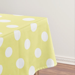 Witte poolpunten op buttergeel tafelkleed