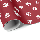 Witte pootafdrukkenpatroon op rood cadeaupapier (Rol Hoek)