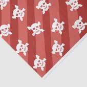 Witte schedel en kruisbeenderen op rode strepen tissuepapier (Detail)