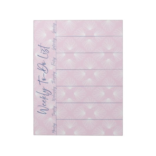 Witte schelpen op lichtroze wekelijkse to-do lijst notitieblok (Linkerzijde)