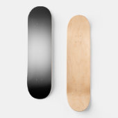 Witte schijnwerper op zwart persoonlijk skateboard (Voorkant)
