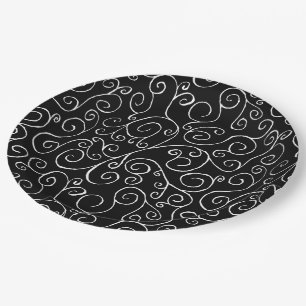 Witte scrollende curven op zwart papieren bordje
