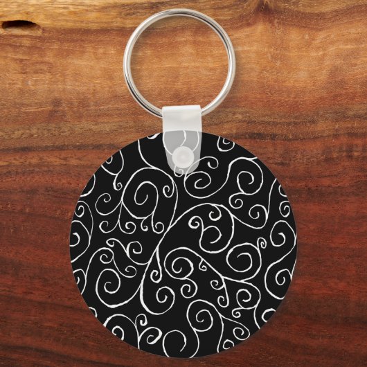 Witte scrollende curven op zwart sleutelhanger (Voorkant)
