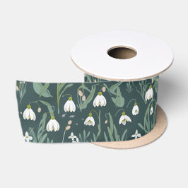 Witte sneeuwklokjes bloemen op groen satijnen lint