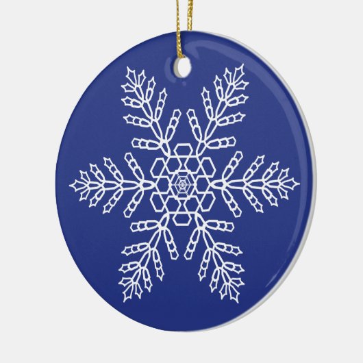 Witte sneeuwvlok op blauwe achtergrond keramisch ornament (Links)