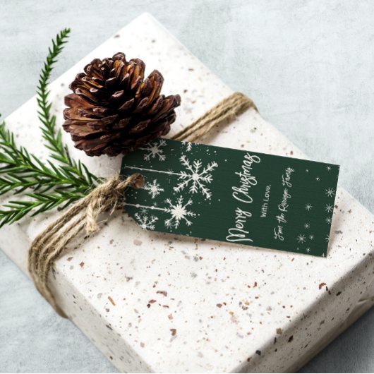 Witte sneeuwvlokken elegante groene vrolijke kerst cadeaulabel