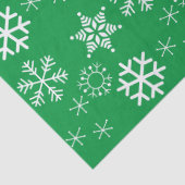 Witte sneeuwvlokken en groene achtergrond kerst tissuepapier (Detail)