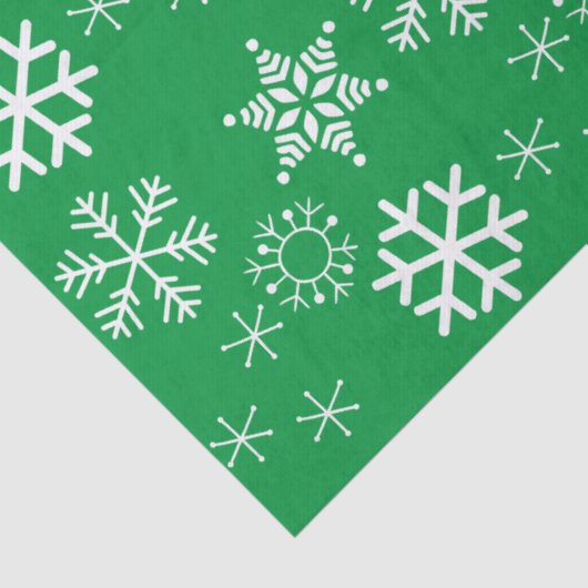 Witte sneeuwvlokken en groene achtergrond kerst tissuepapier (Detail)