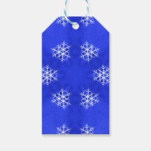 Witte sneeuwvlokken helderblauwe achtergrond