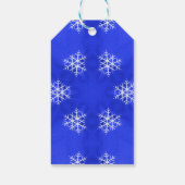 Witte sneeuwvlokken helderblauwe achtergrond cadeaulabel (Achterkant)