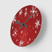 Witte sneeuwvlokken met rode achtergrond ronde klok (Hoek)