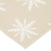 Witte sneeuwvlokken op beige Xmas tablecloth. Tafelkleed (Gekanteld)