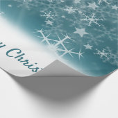 Witte sneeuwvlokken op blauw cadeaupapier (Hoek)