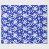 Witte sneeuwvlokken op blauw cadeaupapier (Vlak)